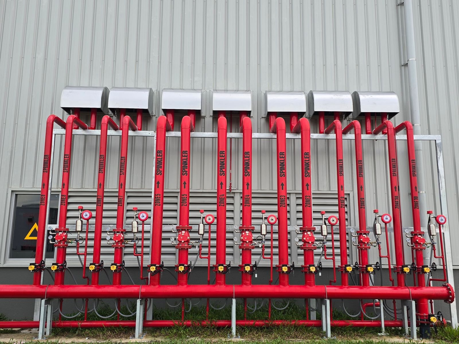 Red industrial fire sprinkler system pipes